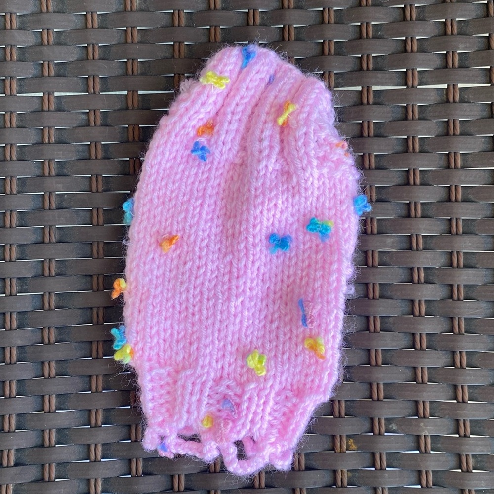 XXS Pink knit dog sweater with bows.